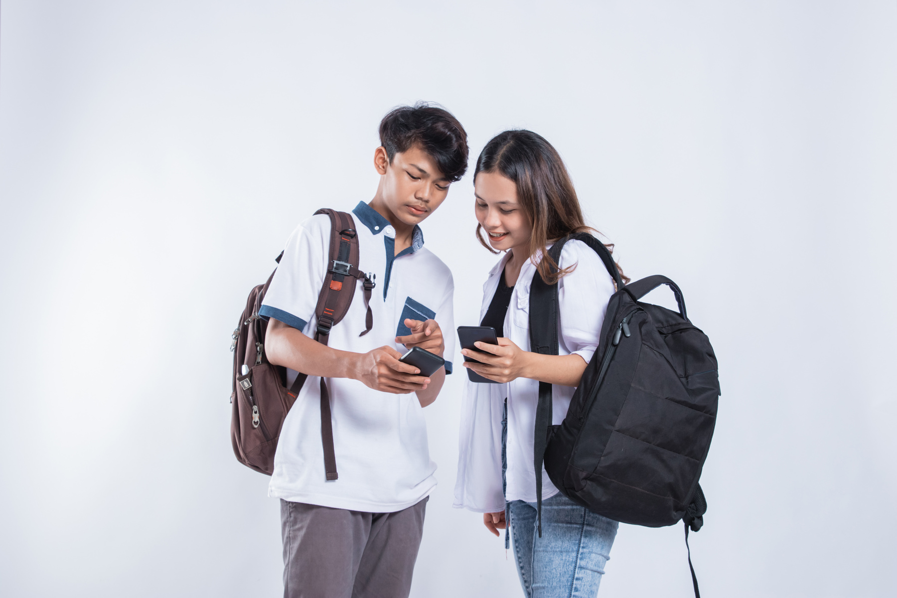 Portrait of Happy University Youth Discussion Looking at Cell Phones